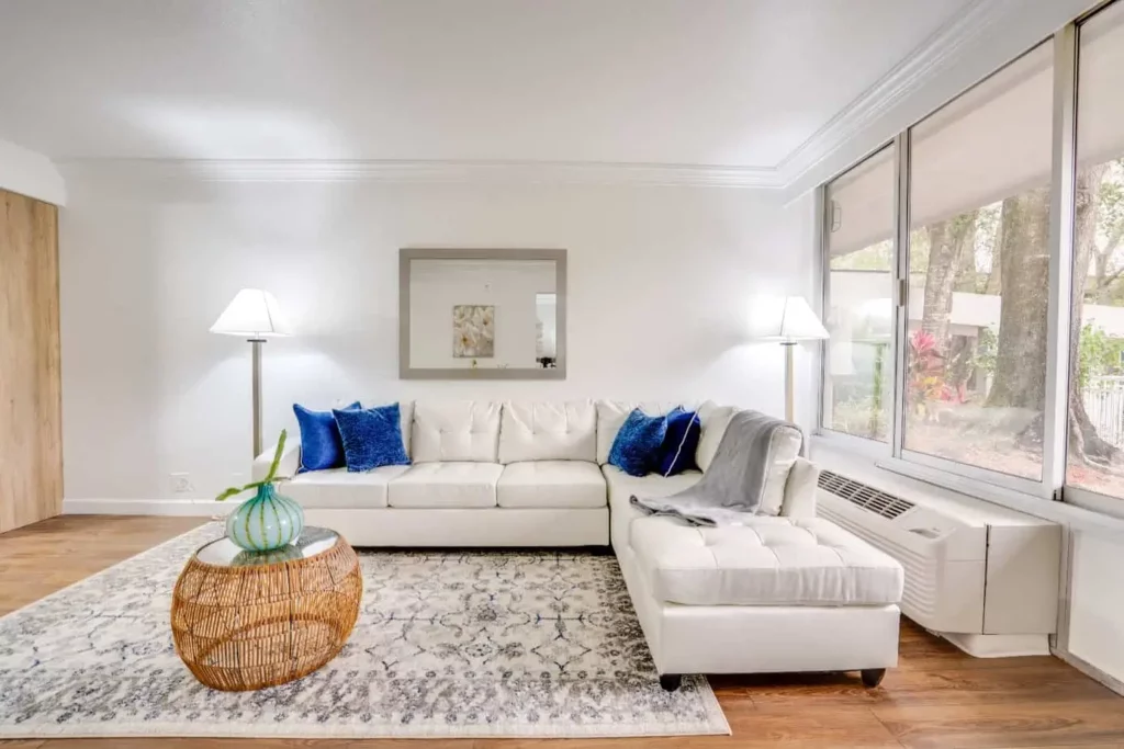 Maingate Village apartment lounge area with stylish furnishings and warm lighting