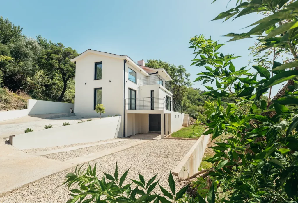 Exterior view of MediVilla I featuring modern villa design and surrounding greenery