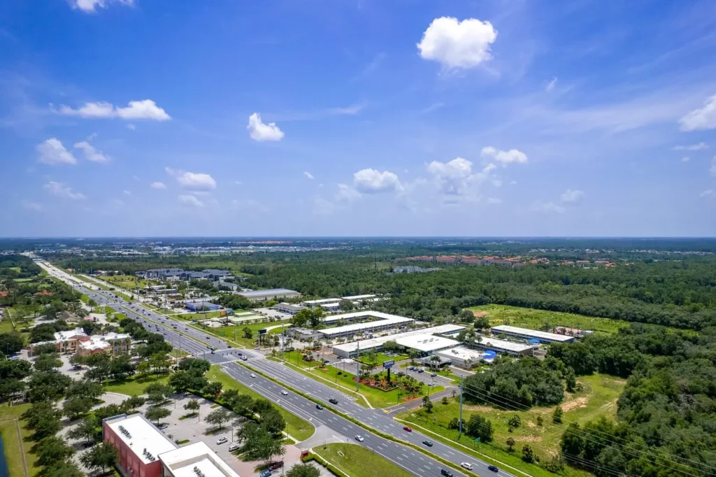 Aerial photo of Champions Village showing entire residential complex and surrounding landscape